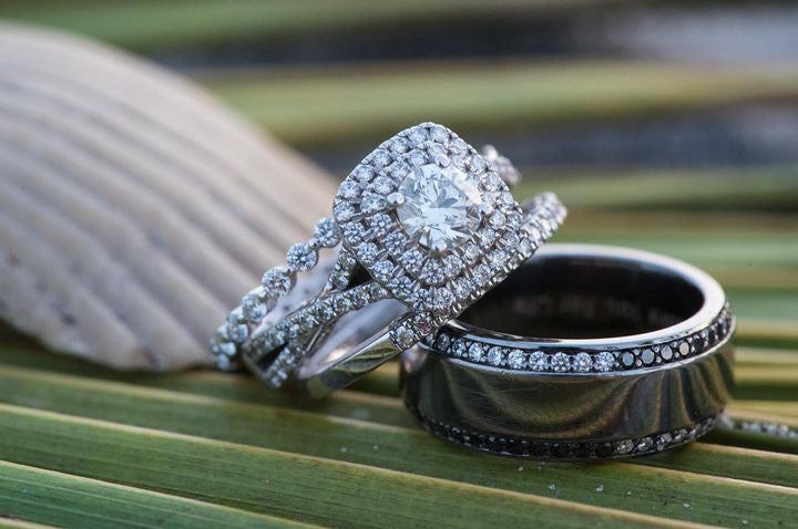 Diamondboi engagement ring and wedding bands close-up