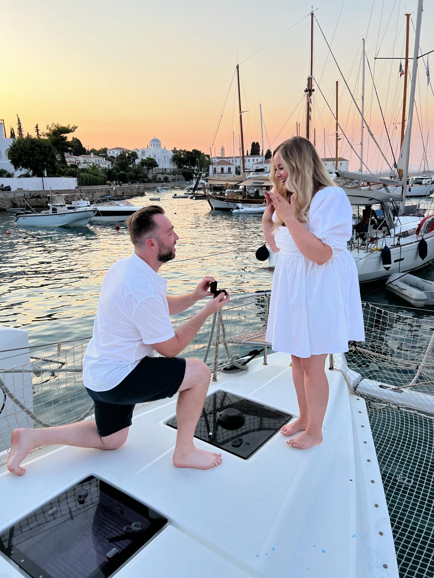 Sailboat proposal at sunset