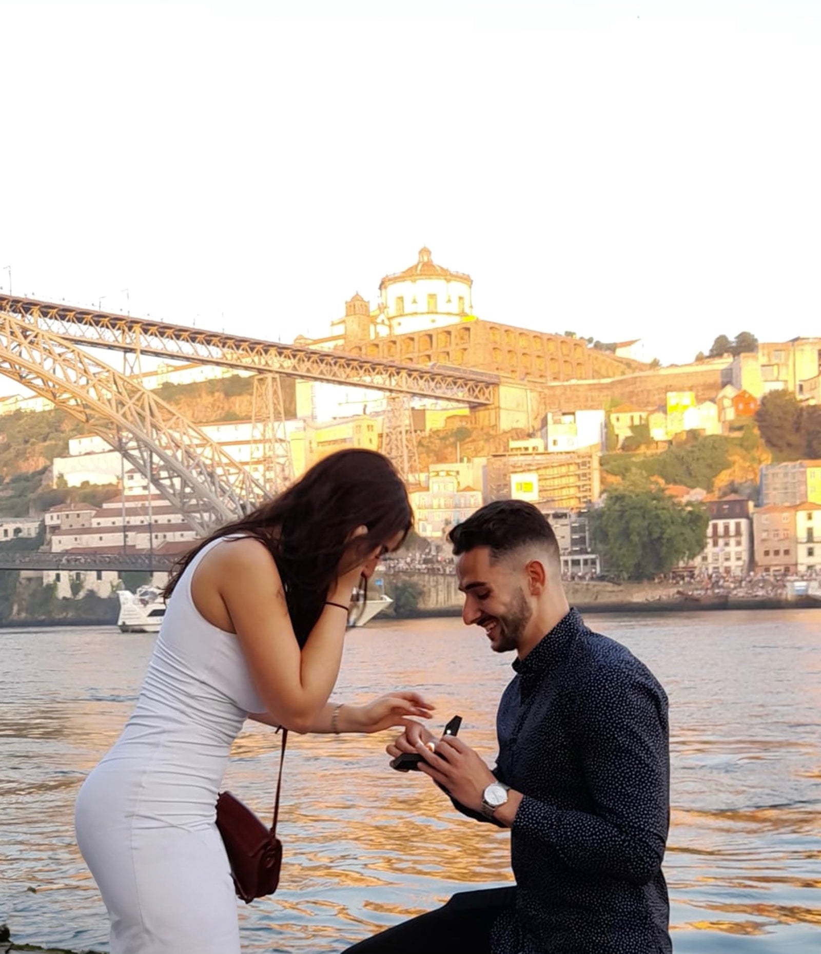 Proposal on the riverfront in Porto with a diamondboi engagement ring