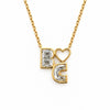 Diamond initial necklace in 14K yellow gold, two lab-grown diamond letters B and C with an open heart on a rolo chain