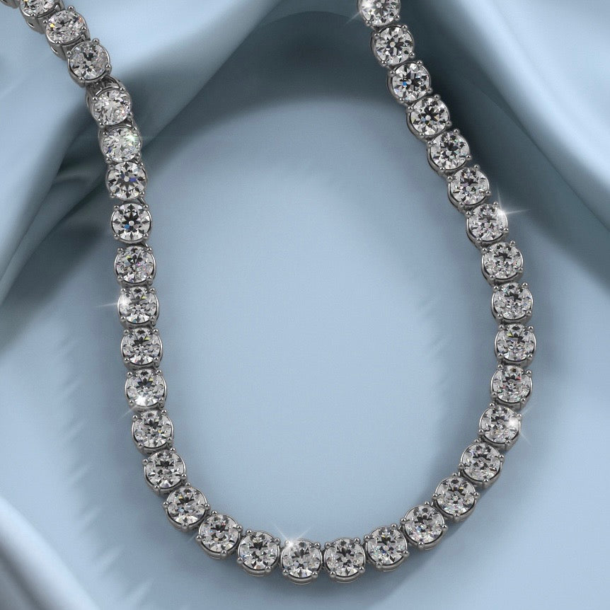 Diamond tennis necklace in 18k white gold – close-up on fabric