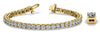 Diamond tennis bracelet in 18k yellow gold with close-up of four-prong setting