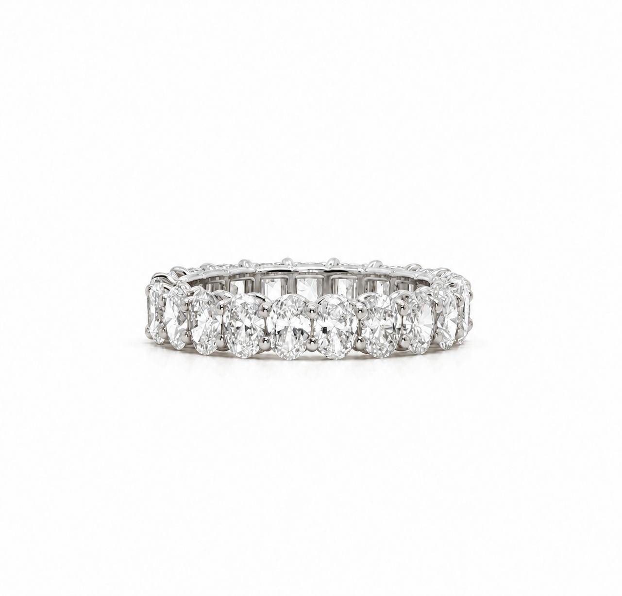 Oval diamond eternity band in 18k white gold
