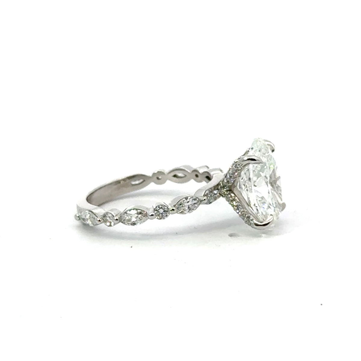 Oval lab diamond ring with marquise and round diamond band, 18k white gold – side profile