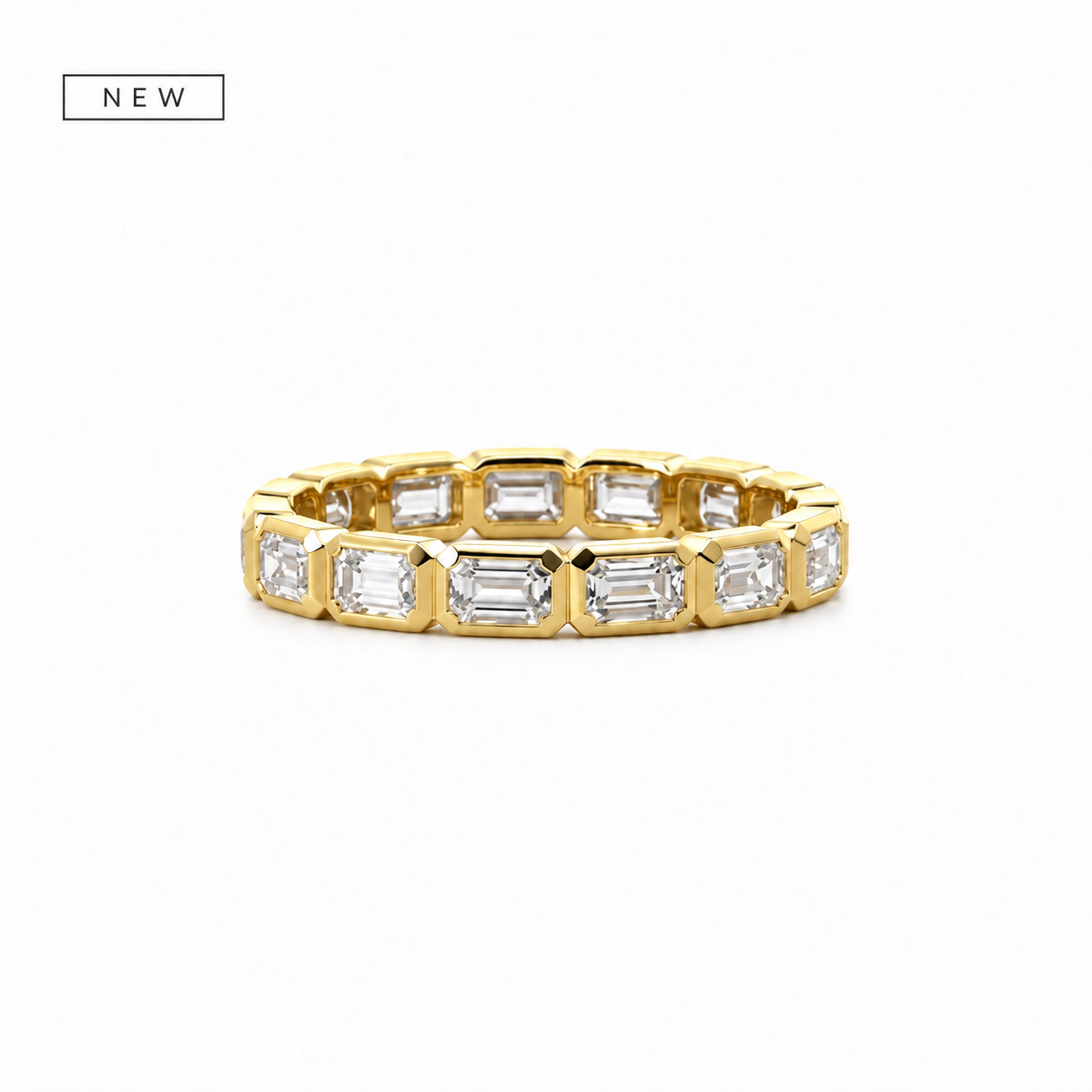 Rotated emerald cut bezel ladies diamond wedding band in gold – view 1 of 2